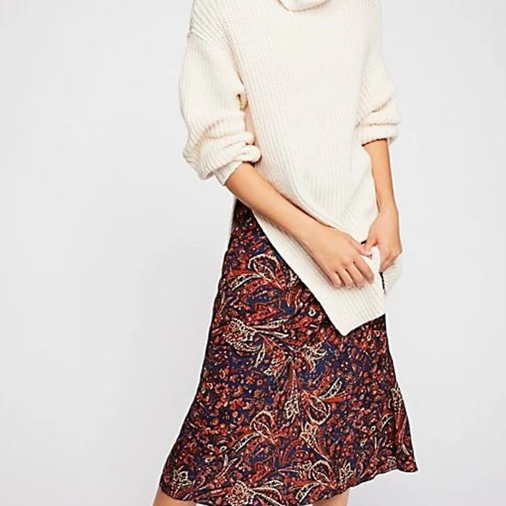 Free People Eleven Turtleneck Sweater in‎ Cream.